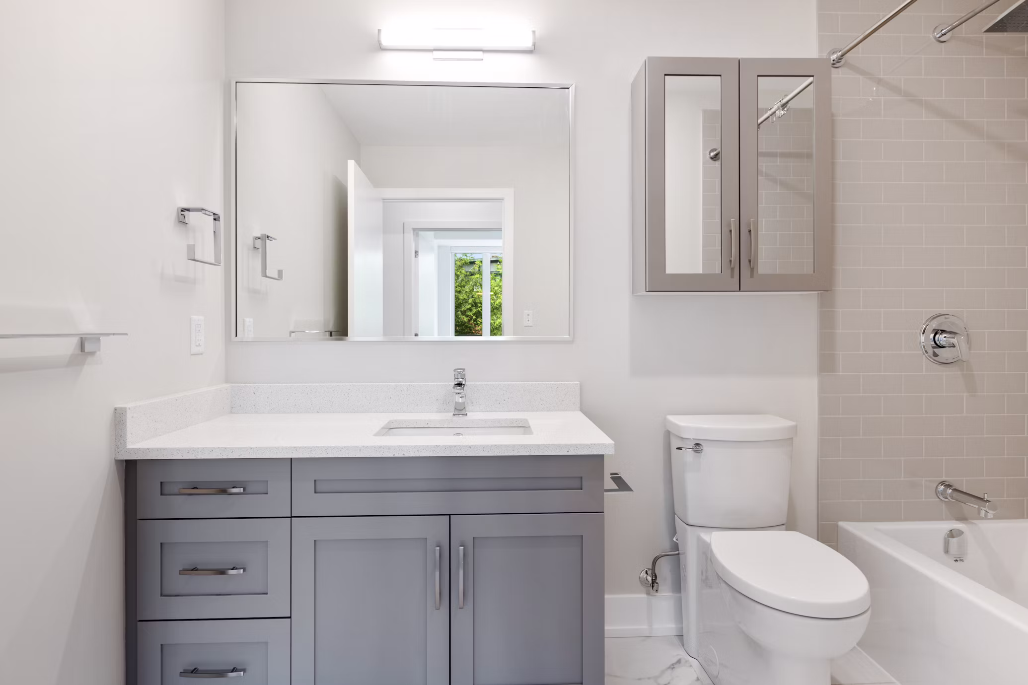 Updated bathroom with modern tile and fixtures