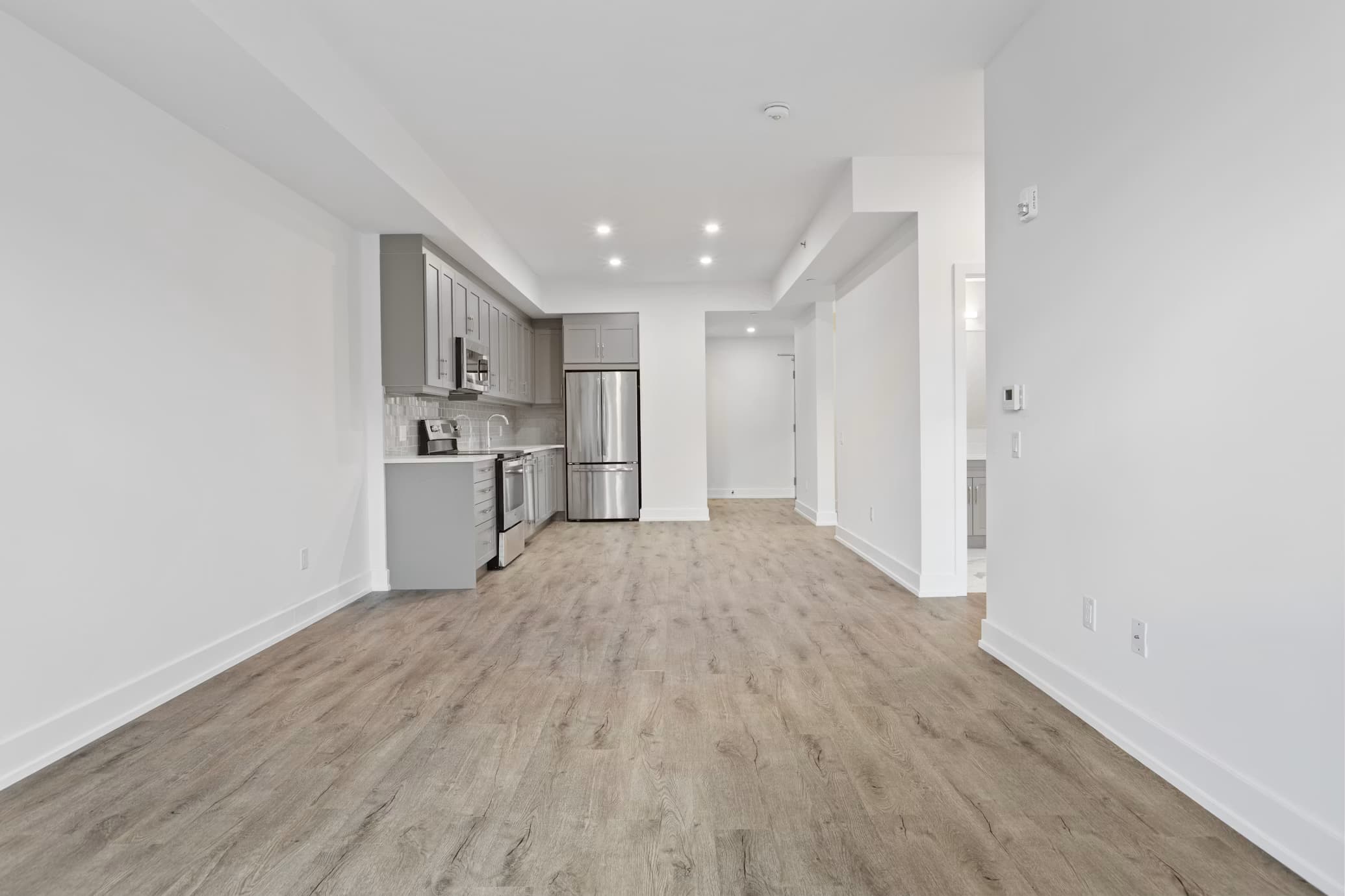 Newly installed hardwood-style flooring in a finished room
